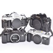 Four Canon SLR camera bodies