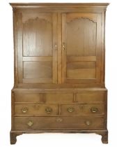 A George III oak press cupboard.