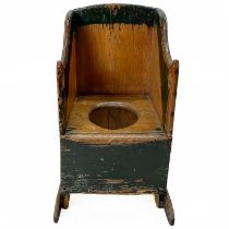 A Victorian green painted pine child's box commode chair.