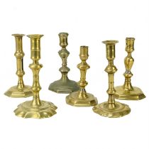 An 18th century brass candlestick.