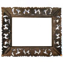 A Continental carved oak frame.