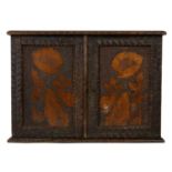 A late Victorian pine poker work small wall cabinet.