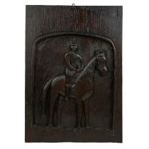 A naive oak plaque carved with a mounted horse.