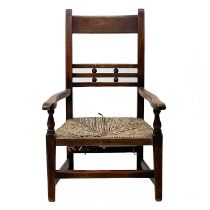 A 19th century fruitwood child's armchair.