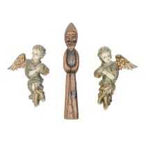 A pair of wood carved painted gesso putti.