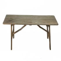 A folding pine trestle table, of diminutive proportions.