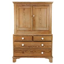 A Victorian pitch pine two part cabinet.