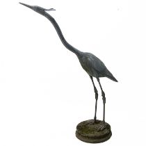 A lead garden figure of a heron.