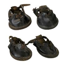 A set of four leather pony shoes.