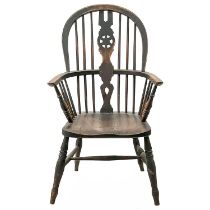 A Victorian ash and elm wheelback Windsor armchair.