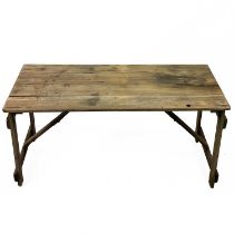 A pine folding trestle table.