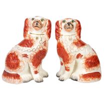 A pair of Staffordshire pottery spaniels.