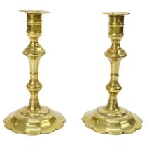 A pair of 18th century brass candlesticks.