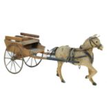 An early 20th century model of a horse and cart.