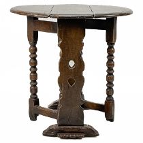 A 17th century style small oak gateleg table.