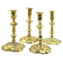 A matched pair of 18th century brass candlesticks.