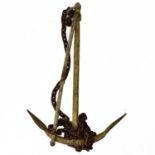 A wrought iron ships anchor.