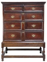 An 18th century oak chest of drawers on a stand.