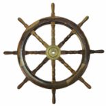A 20th century teak ship's wheel.