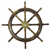 A 20th century teak ship's wheel.