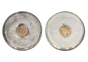 A pair of Islamic silver .800 coin dishes.