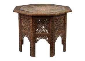 An Anglo Indian carved wood folding occasional table.