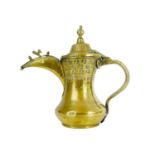 A Saudi Arabian brass dallah pot, 19th century.