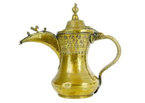 A Saudi Arabian brass dallah pot, 19th century.
