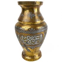 A Cairoware brass and silver inlaid vase, Egypt, circa 1900.