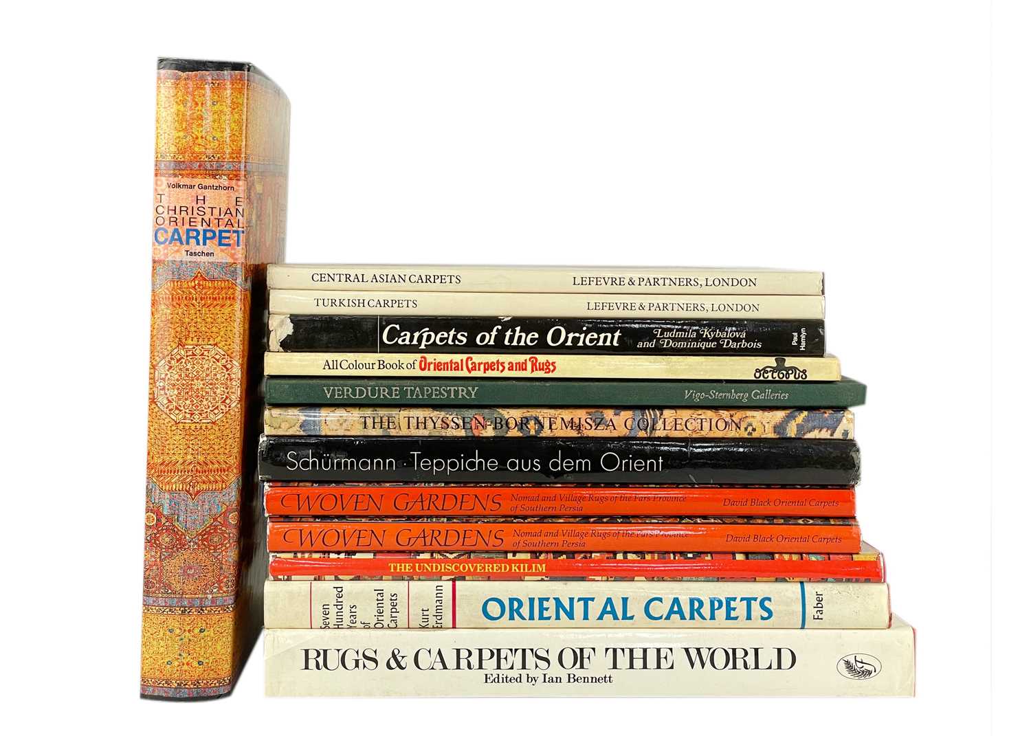 Thirteen books relating to antique rugs and carpets.