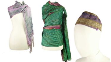 A selection of Asian textiles including an Islamic embroidered cap and an Indian sari.