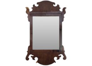 A 19th century walnut fretwork mirror.