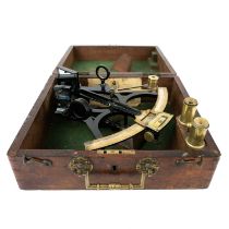 A cased sextant.