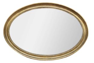 A 19th century oval gilt gesso mirror.