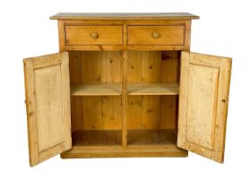 A pine side cabinet.