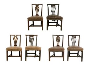A set of six George III provincial mahogany dining chairs.