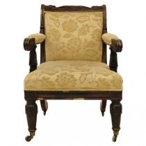 A Regency oak framed armchair.
