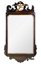 A George III mahogany fretwork wall mirror.