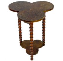 An early 20th century two tier trefoil poker work table.