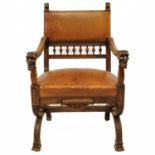A late 19th century Italian carved walnut and leather chair.