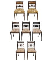 A set of five Regency mahogany dining chairs.