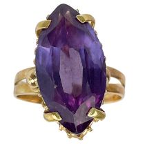 An 18ct synthetic marquise cut purple corundum stone set ring.