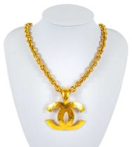 A Chanel 22ct gold-plated quilted CC pendant necklace.