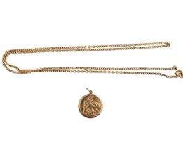 A 9ct rose gold St. Christopher pendant on trace link chain.