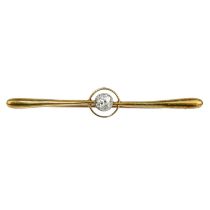 A 15ct bar brooch target set with a single 0.20ct round cut diamond.