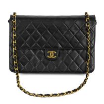 A Chanel black quilted lambskin single flap wallet shoulder bag.
