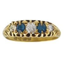 An Edwardian 18ct diamond and sapphire set five stone ring.