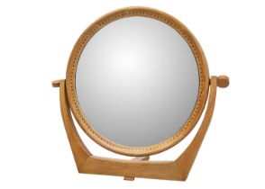 A mid century walnut inlaid circular dressing table mirror.