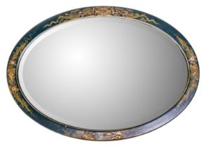 An early 20th century Chinoiserie lacquered oval mirror.