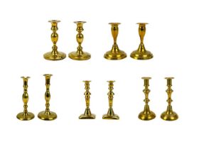 A pair of 19th century brass candlesticks.